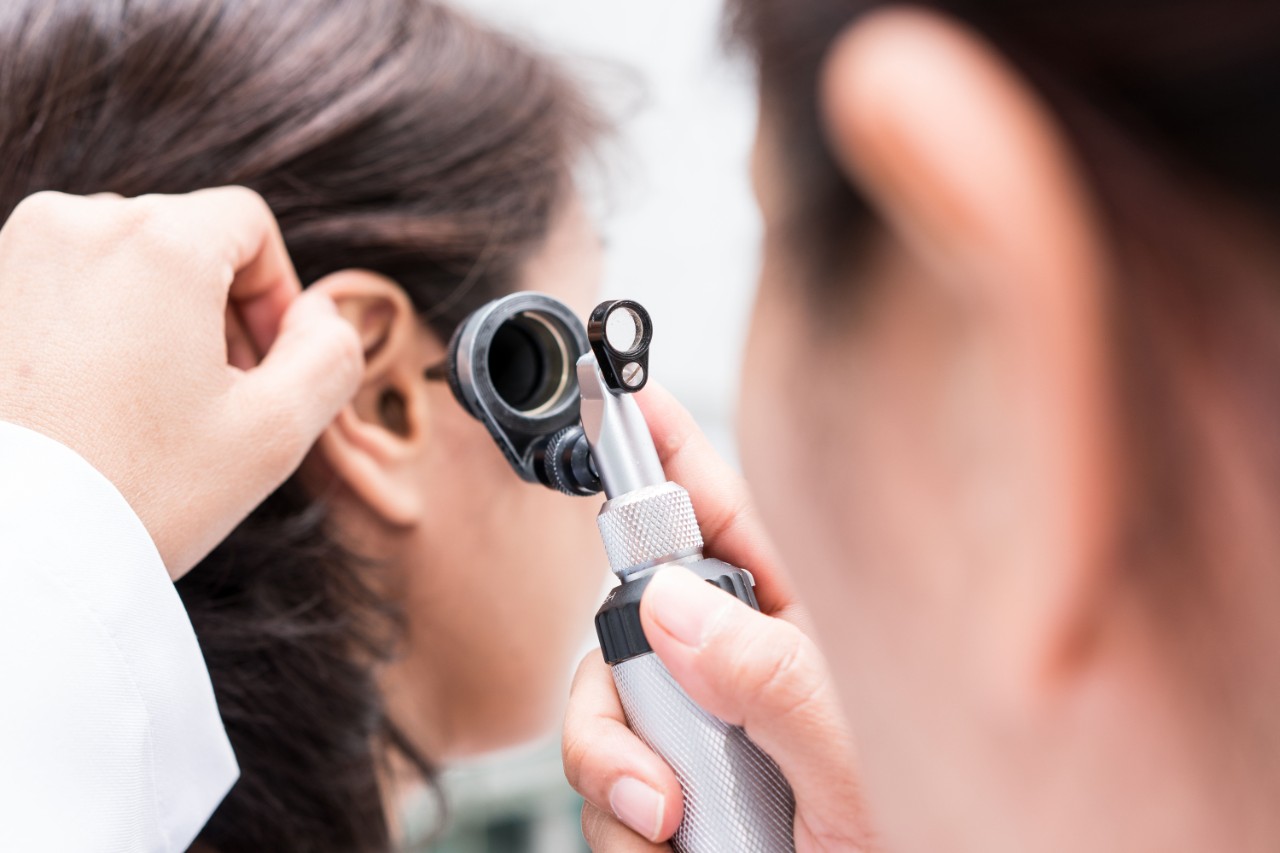 a woman taking a hearing exam 