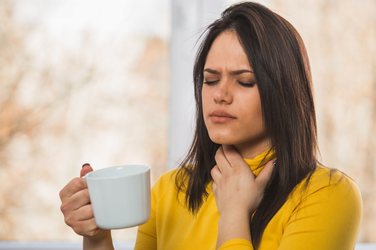 a woman with sore throat