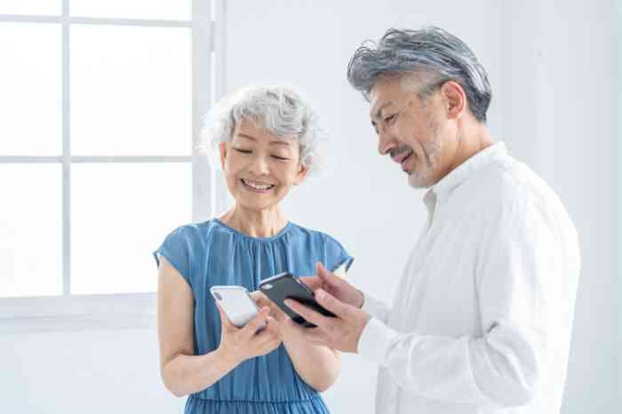 A couple looking at their phones