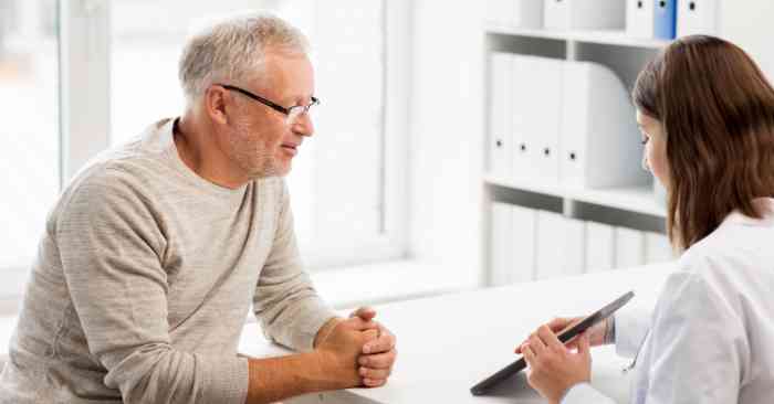 A doctor and a patient in a office