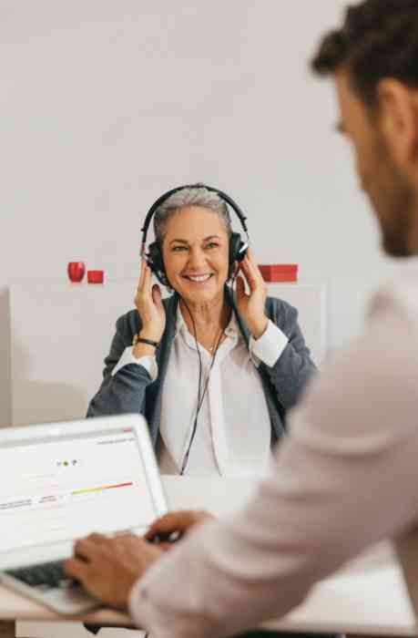 a woman taking a hearing exam 