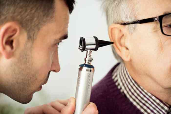 a doctor checking a patient's ear health