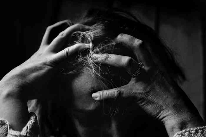 Black and white picture woman with headache