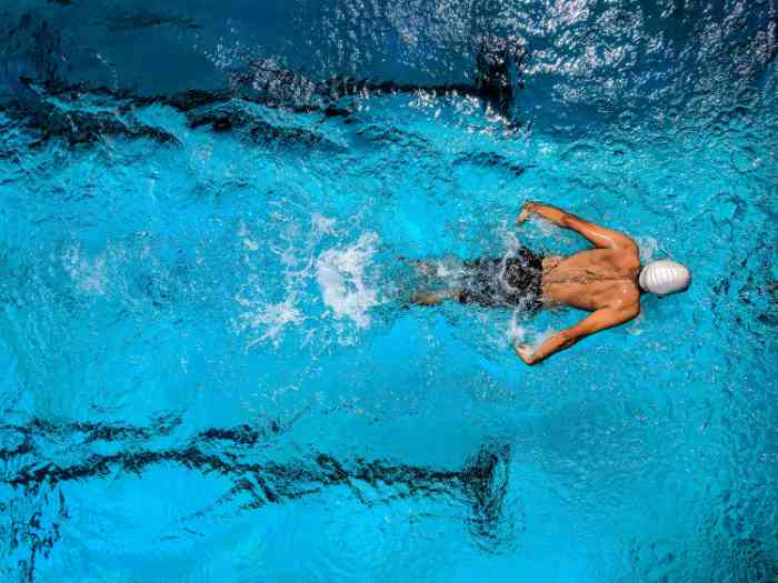 A man swimming in a pool