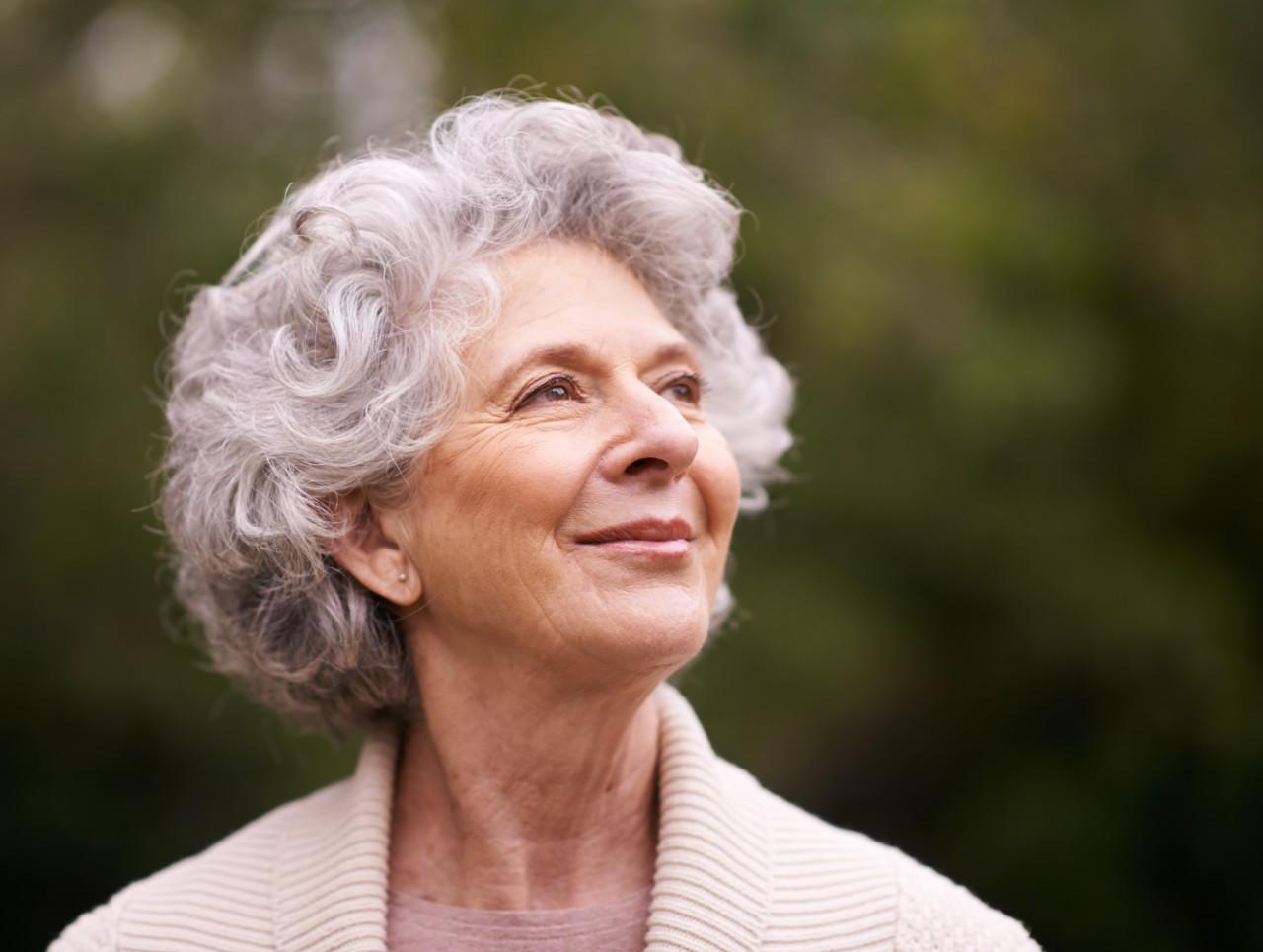 Elderly woman smiling outside