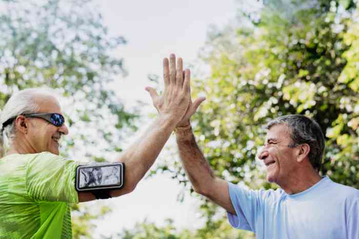 Senior adults giving a high five