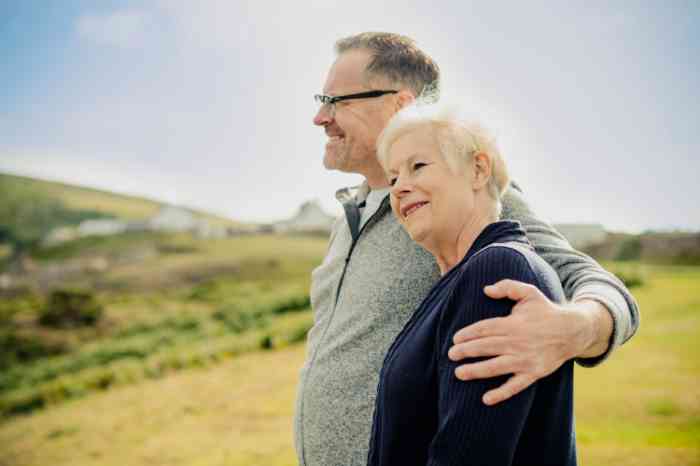 Couple smiling looking at the fields