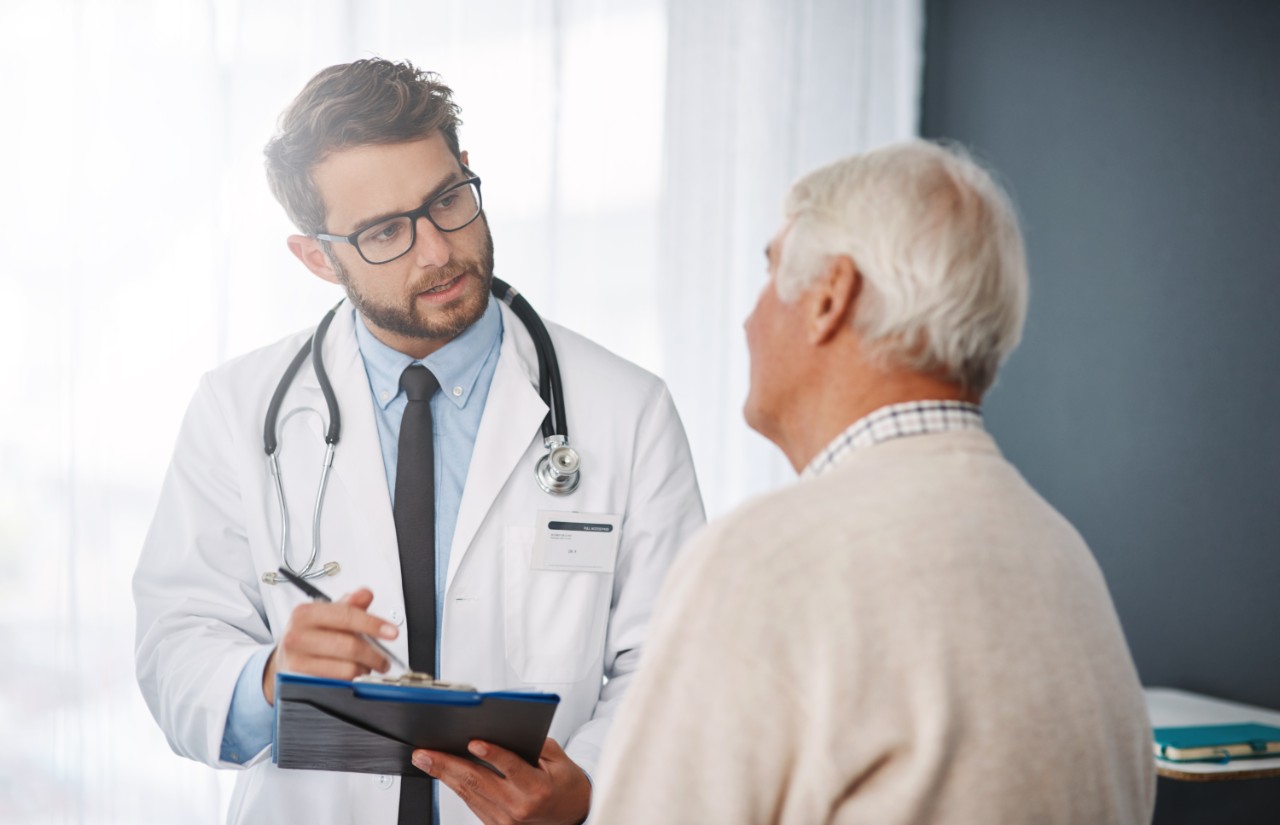 Doctor speaking with a senior man