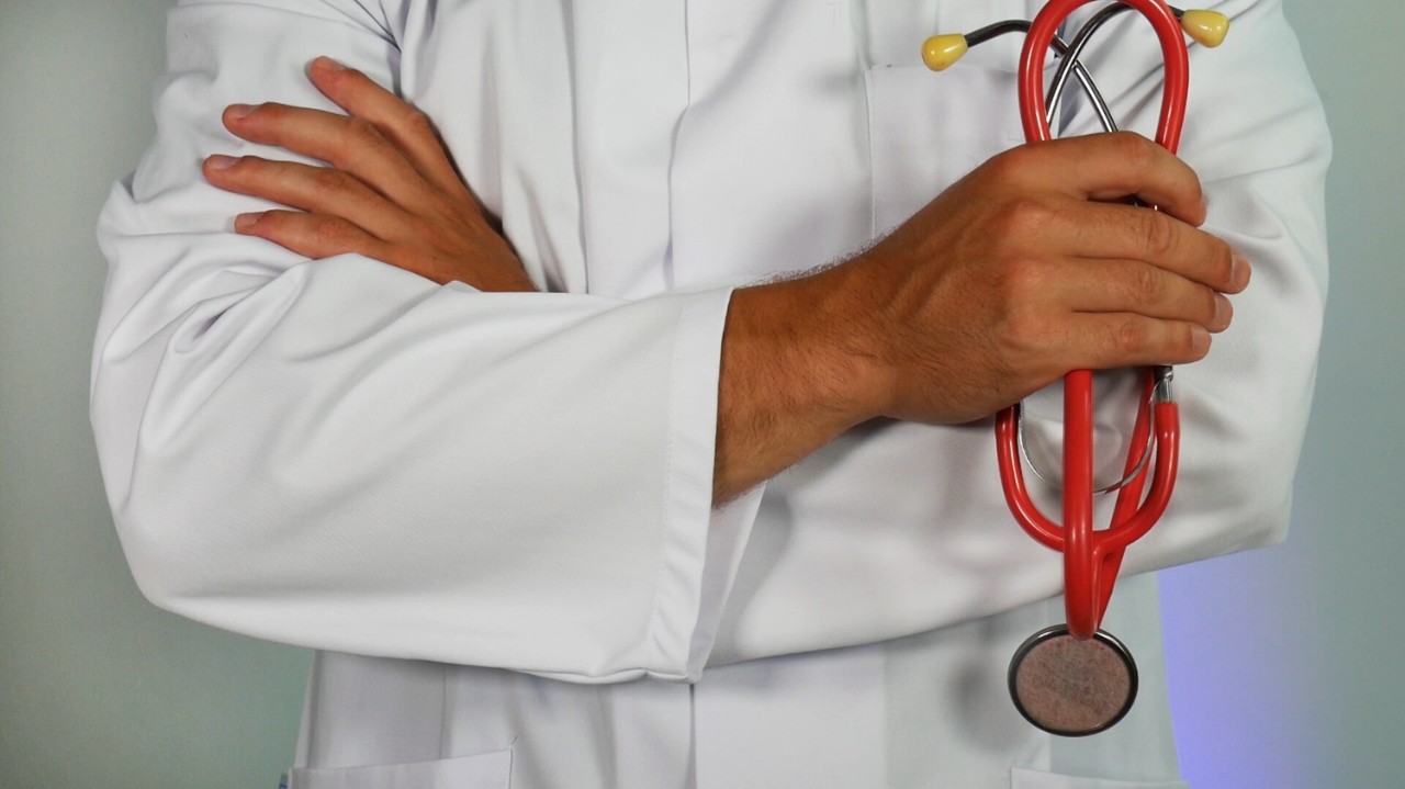 Male doctor holding a stethoscope