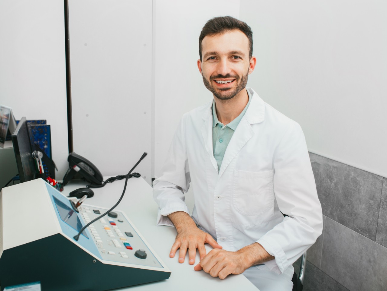 Smiling doctor at the hearing station