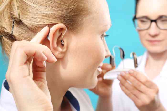woman trying an hearing aid 